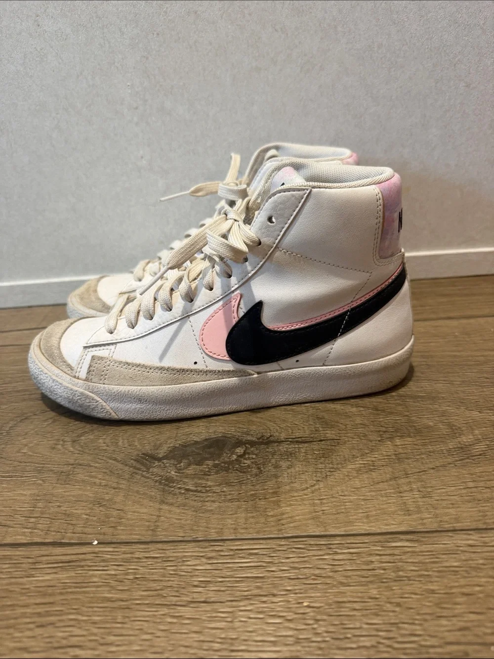 Nike Kid’s White High-Top Sneakers with Pink Accents and Black Swoosh
